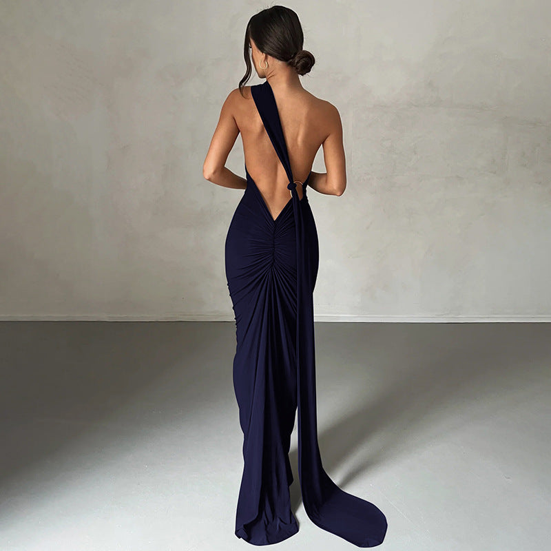 Summer women's fashionable backless, halter-neck, figure-hugging, curvaceous evening dress with a fitted bodice. Women's dress.