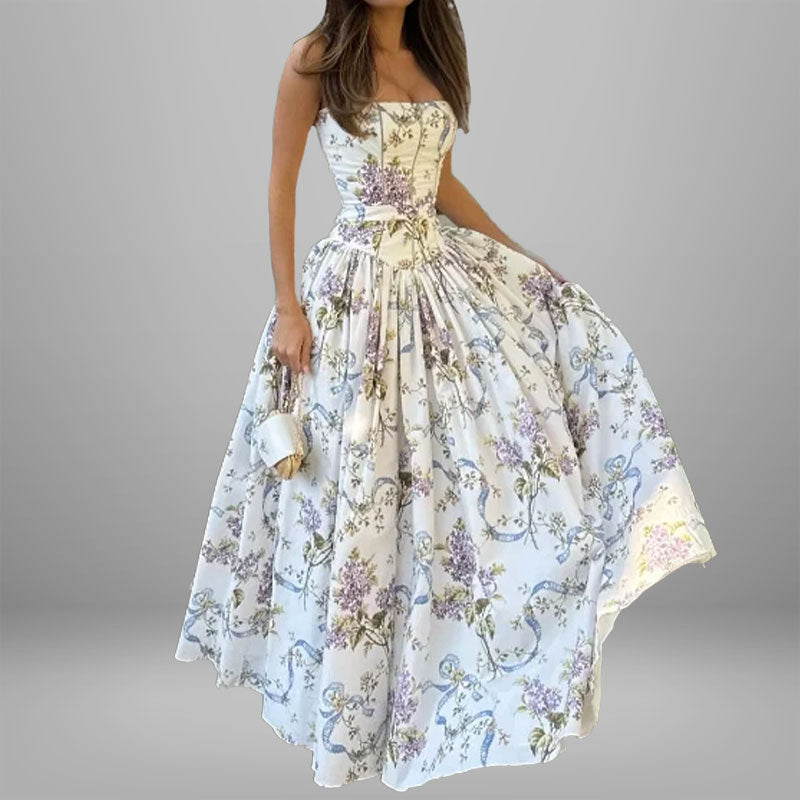 Women's dress: Long dress with elegant print, wide hem, and strapless design.