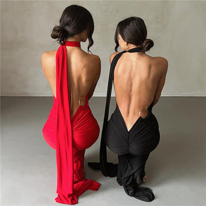 Summer women's fashionable backless, halter-neck, figure-hugging, curvaceous evening dress with a fitted bodice. Women's dress.
