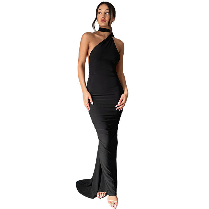 Summer women's fashionable backless, halter-neck, figure-hugging, curvaceous evening dress with a fitted bodice. Women's dress.