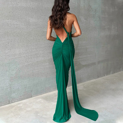 Summer women's fashionable backless, halter-neck, figure-hugging, curvaceous evening dress with a fitted bodice. Women's dress.