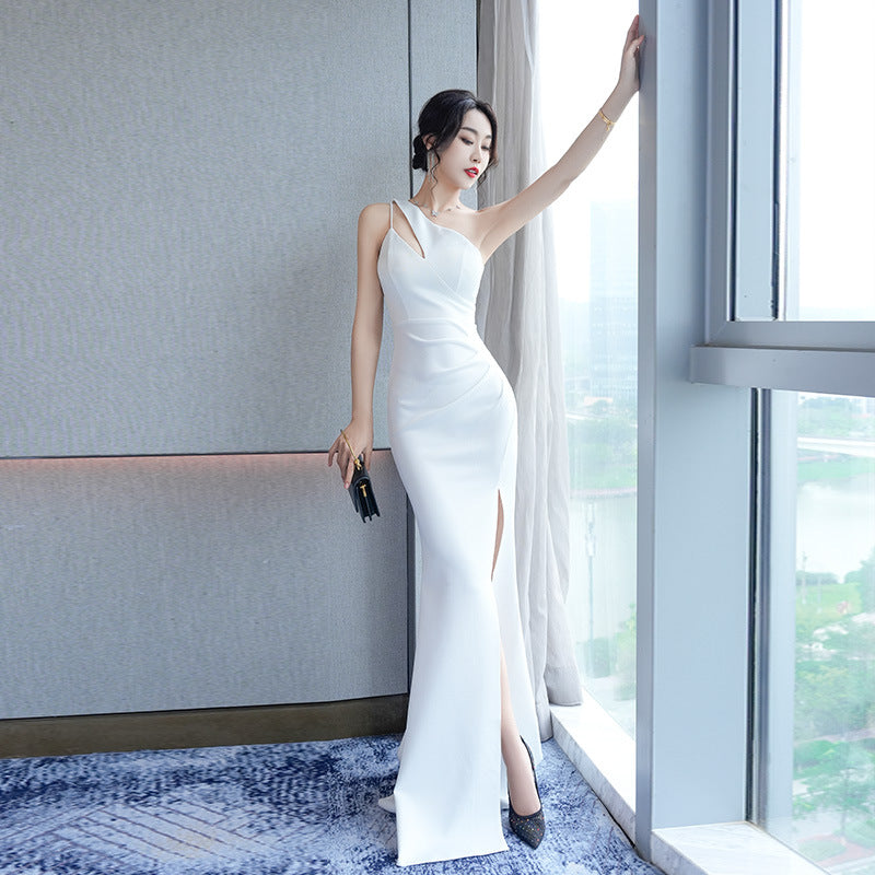 Long-style evening dress with straps, featuring a sexy hourglass silhouette and a single shoulder design, of high-end quality.