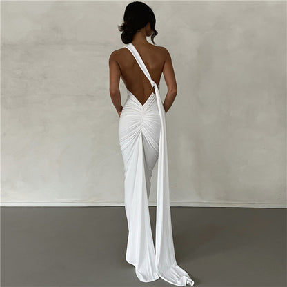 Summer women's fashionable backless, halter-neck, figure-hugging, curvaceous evening dress with a fitted bodice. Women's dress.