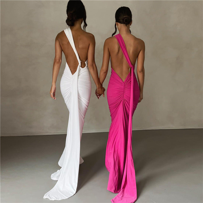 Summer women's fashionable backless, halter-neck, figure-hugging, curvaceous evening dress with a fitted bodice. Women's dress.