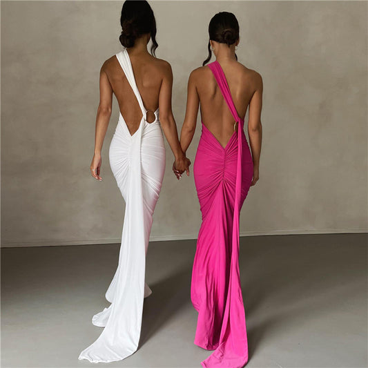 Summer women's fashionable backless, halter-neck, figure-hugging, curvaceous evening dress with a fitted bodice. Women's dress.