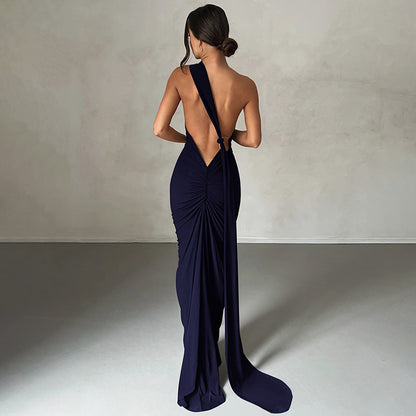 Summer women's fashionable backless, halter-neck, figure-hugging, curvaceous evening dress with a fitted bodice. Women's dress.