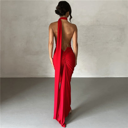 Summer women's fashionable backless, halter-neck, figure-hugging, curvaceous evening dress with a fitted bodice. Women's dress.