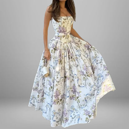 Women's dress: Long dress with elegant print, wide hem, and strapless design.