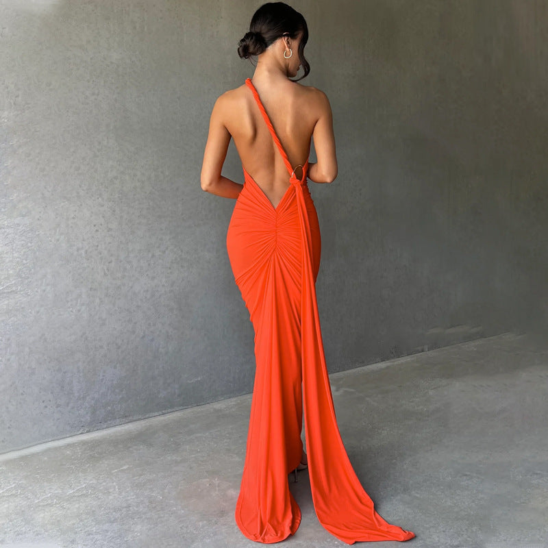 Summer women's fashionable backless, halter-neck, figure-hugging, curvaceous evening dress with a fitted bodice. Women's dress.