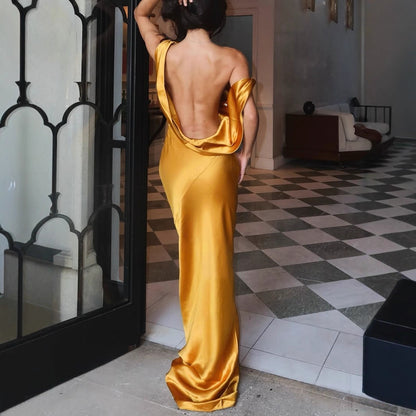 Women's sexy backless evening dress for formal events - a fitted backless dress with a high-end and elegant design.