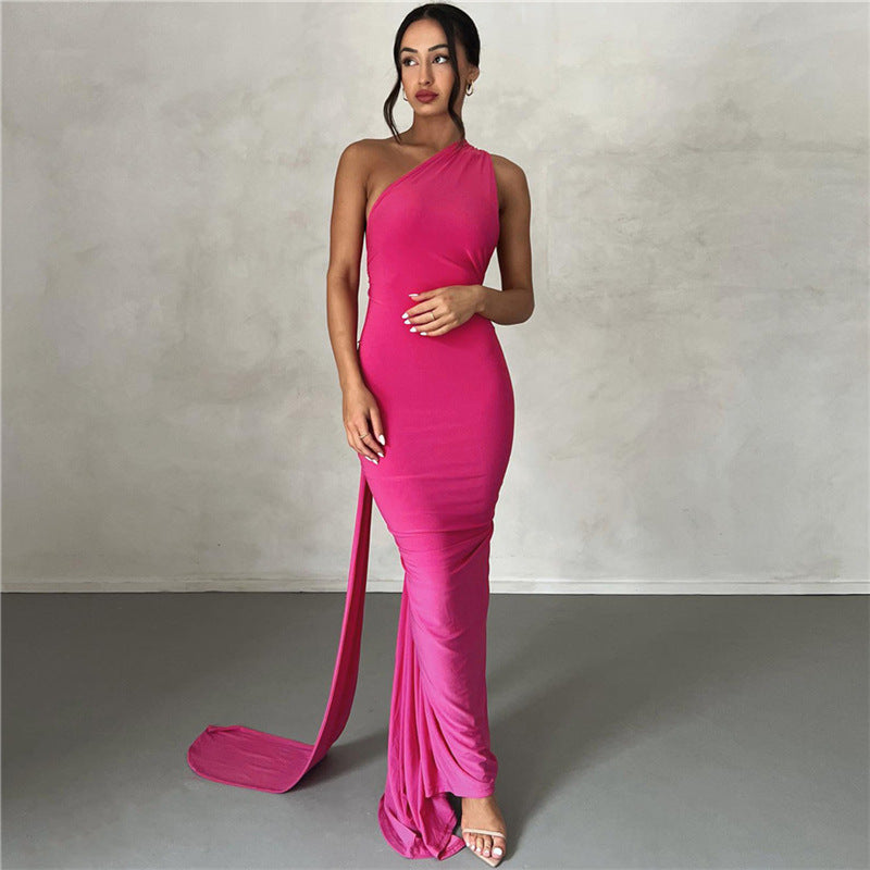 Summer women's fashionable backless, halter-neck, figure-hugging, curvaceous evening dress with a fitted bodice. Women's dress.