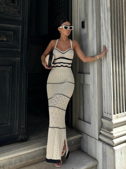 Women's halter top dress with a fitted and hourglass shape, showing off a slim figure. A mid-length, slit, fishtail-style dress. A feminine, bold look for women.
